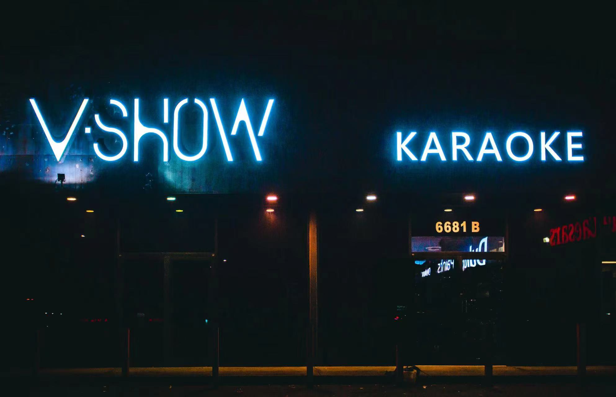 The lit V Show Karaoke sign at the venue entrance in Metrotown, Burnaby